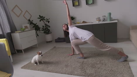 woman exercising at home, video conference call