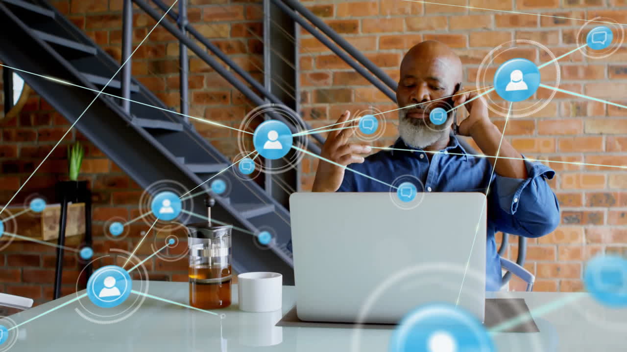 Networking and communication icons animation over man using laptop in modern office