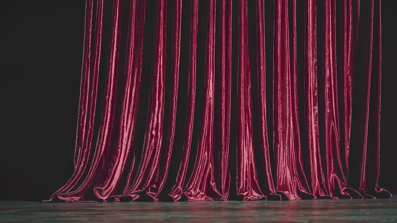 Video of red velvet curtains in a theater setting, captured from a straight-on angle