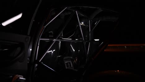 safety cage detail shot in a professional racing car at night