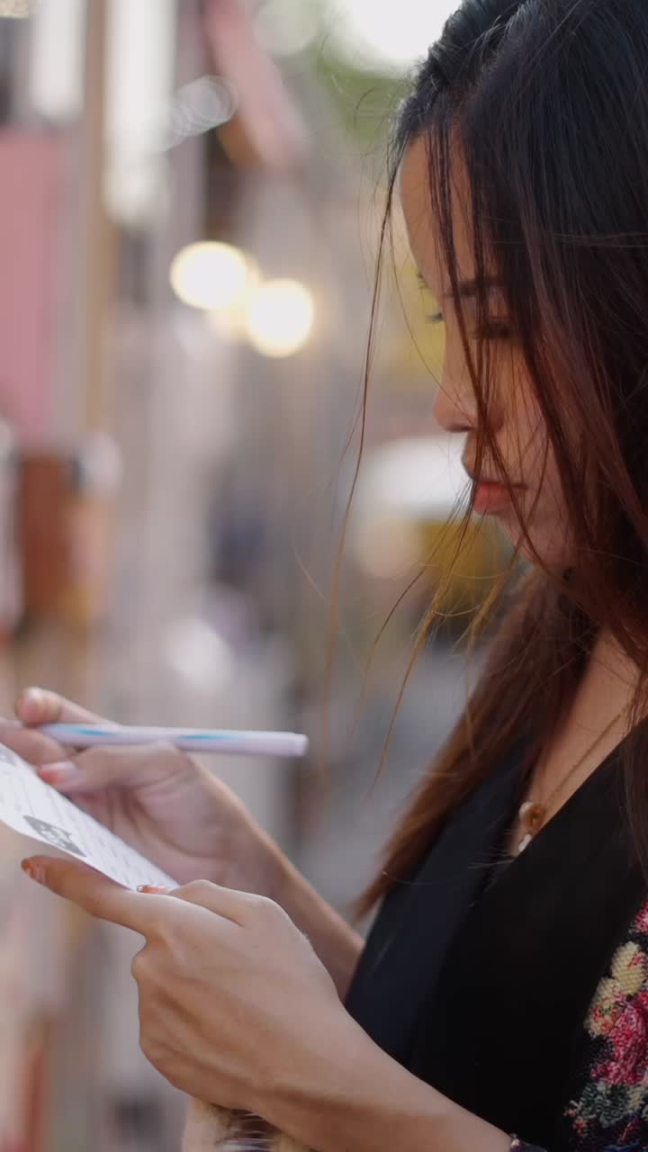 Woman writing on a notepad