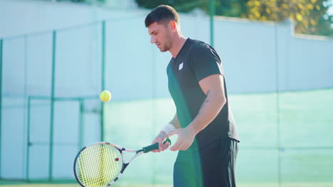 tennis player preparing to serve on a court