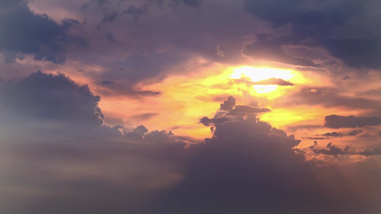Orange Sunset With Light Rays From Behind the Clouds