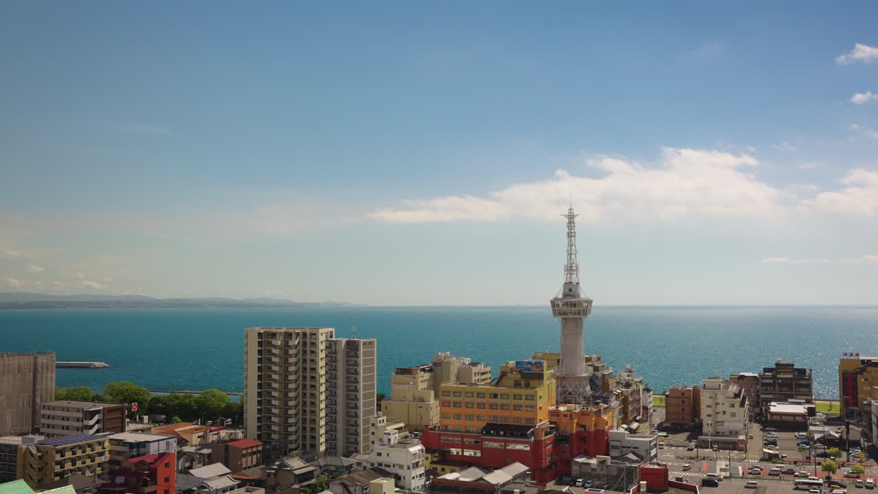 Beppu City and Tower with Ocean in Background, Kyushu Japan Establishing Shot