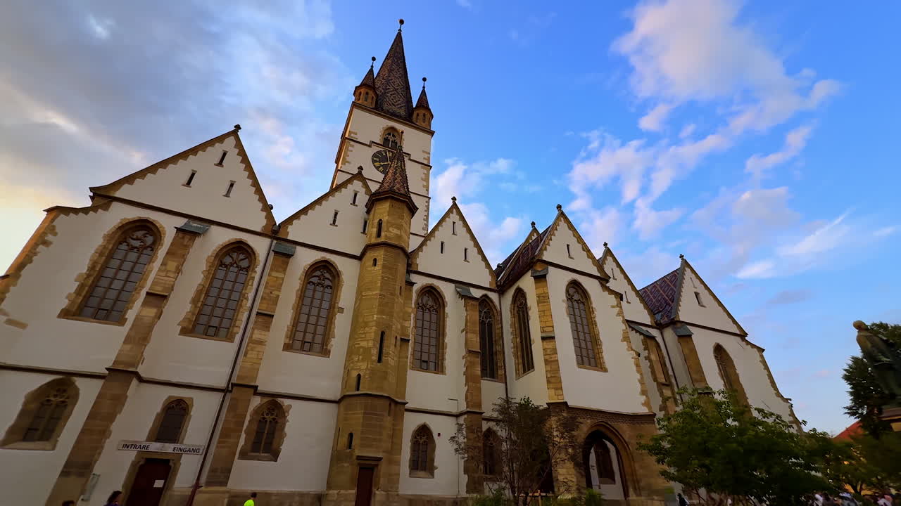 Sibiu, Romania, 17 July 2025: Stunning building of the Lutheran Cathedral of Saint Mary with pointed tops. Low angle view. Sibiu, Romania