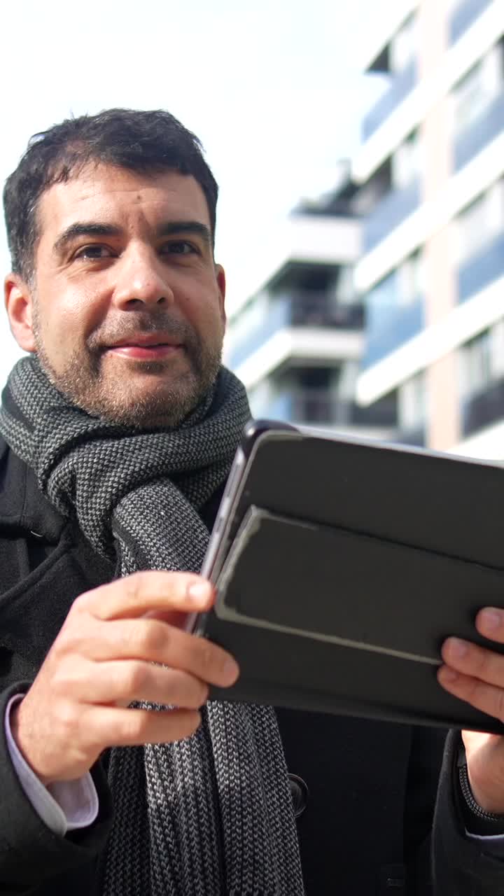 Man with tablet in urban setting