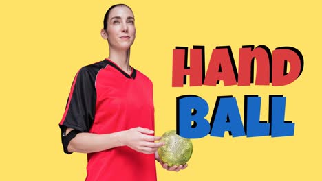 Animation-of-handball-text-over-smiling-caucasian-female-handball-player-holding-ball