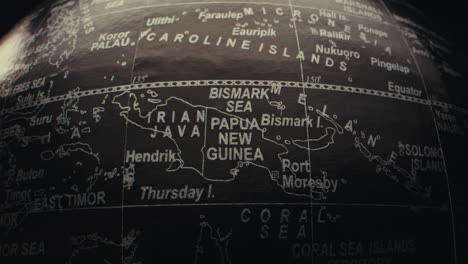 close-up of a world globe focusing on the pacific islands