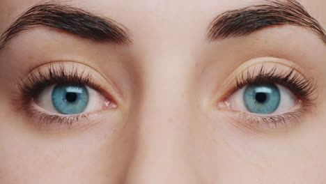 close up macro blue eyes opening natural human beauty