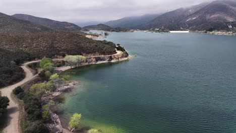 bouquet reservoir in southern california on a moody cloudy day aerial dolly 60fps