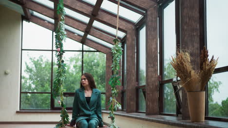 fatigued woman slumps on swings at home. businesswoman energy drained from demanding day of negotiations. woman tired because of high-pressure day