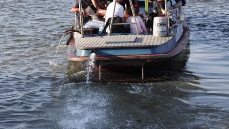 passengers traveling on a small motorboat