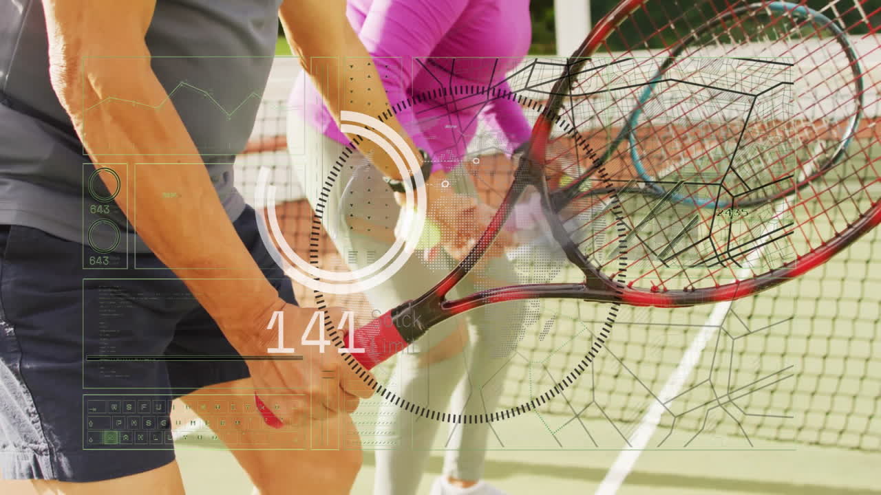 Senior man swinging racket while senior woman returning ball on court, showing sports tech graphs