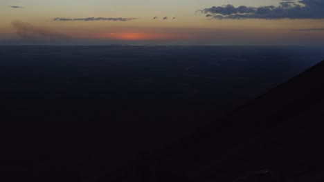 sunset sunrise timelapse, high altitude aerial drone skyline view with clouds golden sky