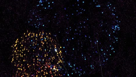 animation of 2022 text in pink with colourful new year fireworks exploding in night sky