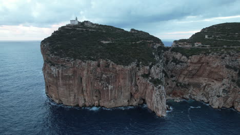 capo caccia, sardinia: majestic aerial images of the lighthouse and cliff of the famous cape on the island of sardinia during sunset