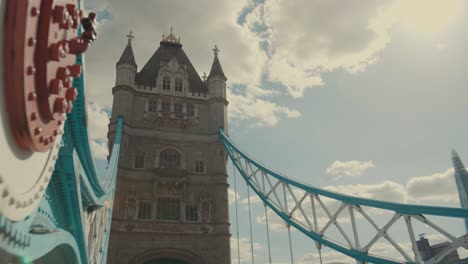 Low-angle-shot-of-the-London-Bridge-shooted-with-the-structure-on-foreground,-UK