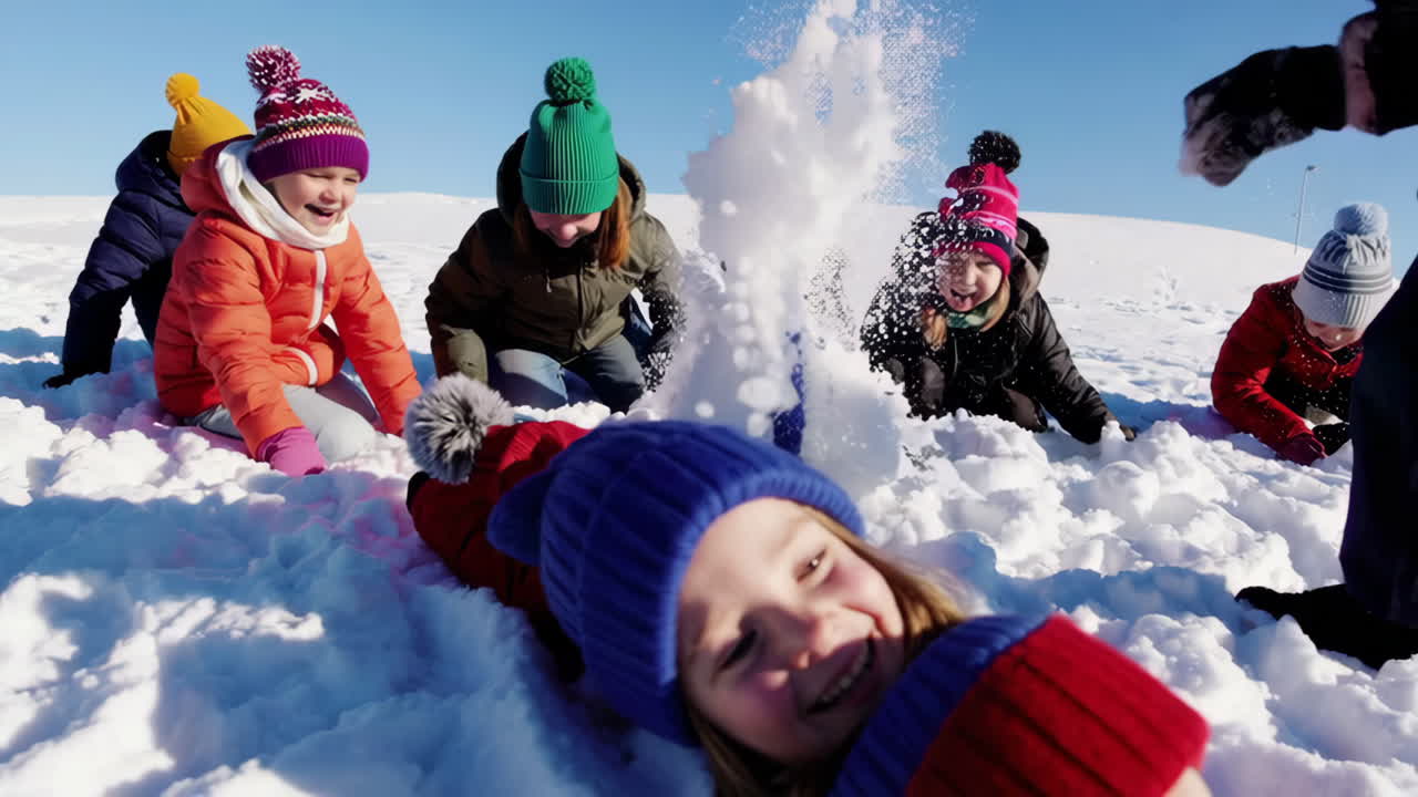 Happy Children Playing in the Snow on a Sunny Winter Day