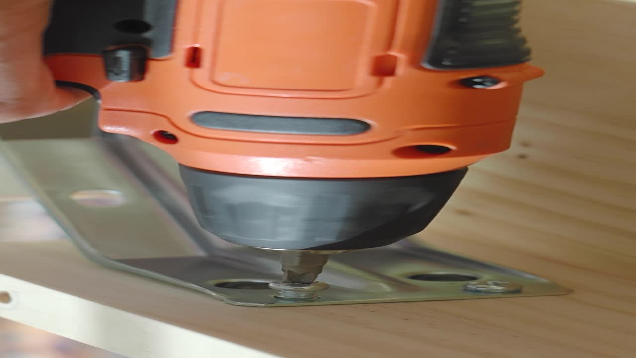 Using a Drill to Install a Metal Bracket on Wood