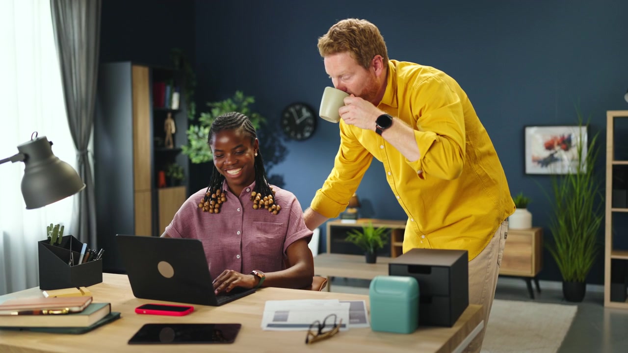 Diverse Colleagues Collaborating on a Project in a Modern Office