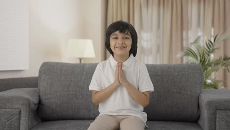 indian boy doing namaste and greetings