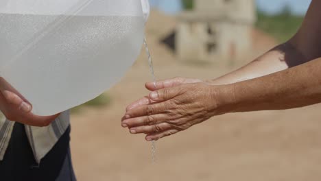 washing of arms and hands with plastic canister