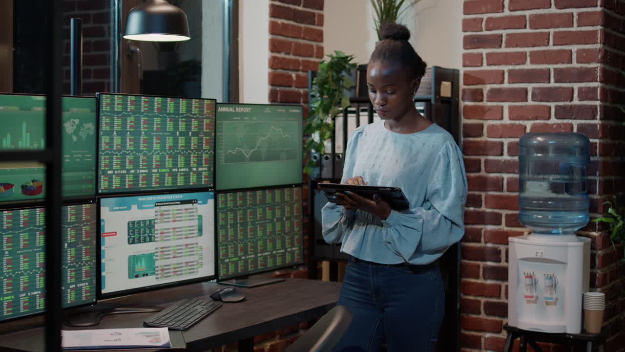 Female investor working with forex exchange on digital tablet