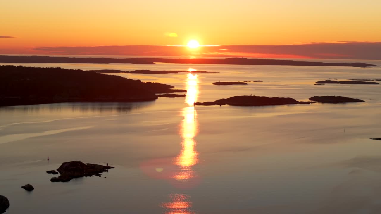 Strömstad Stromstad Sweden aerial drone Scandinavia Arctic Circle islands golden sunset sun rays on horizon peaceful calm still Sandelfjord Fjord Skagerrak Baltic Sea marina harbor picturesque static