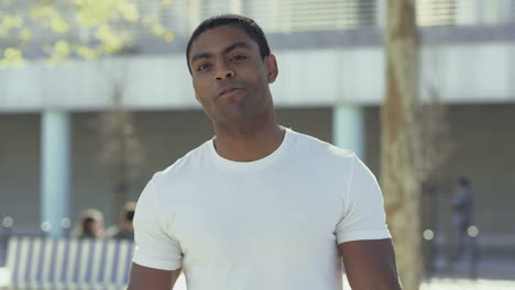 smiling handsome young man talking to camera.