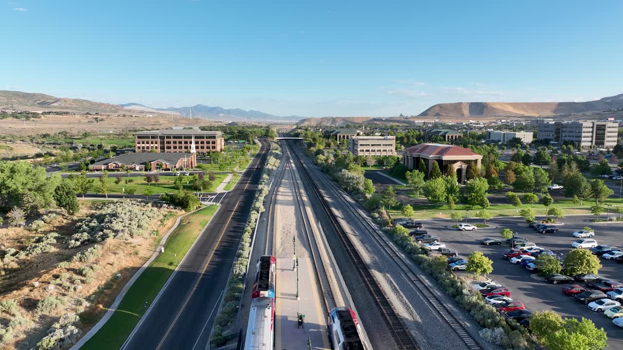 Aerial View of Train Station, City, and Mountains