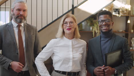 portrait of cheerful multiethnic business team