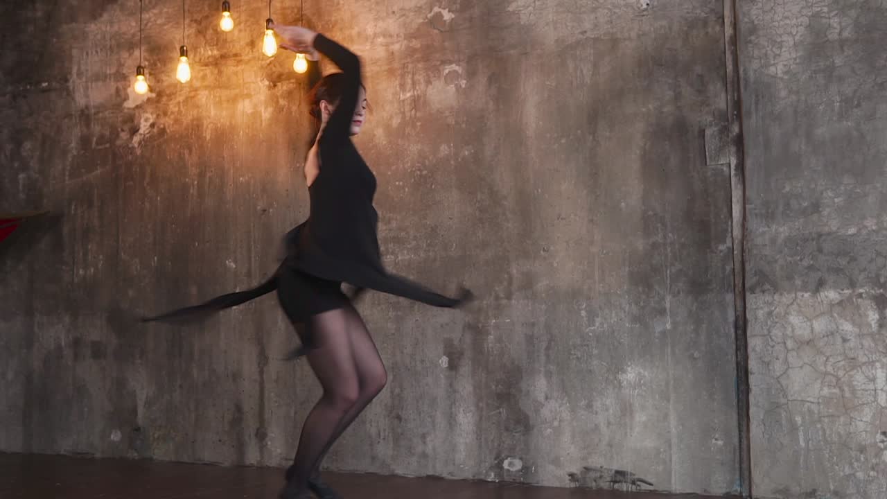 Woman Dancing in a Black Dress