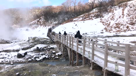 hokkaido-japan, circa : jigokudani, known in english as "hell valley" is the source of hot springs for many local onsen spas in noboribetsu, hokkaido