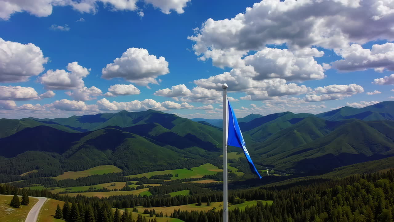 United Nations Flag High Above the Mountains