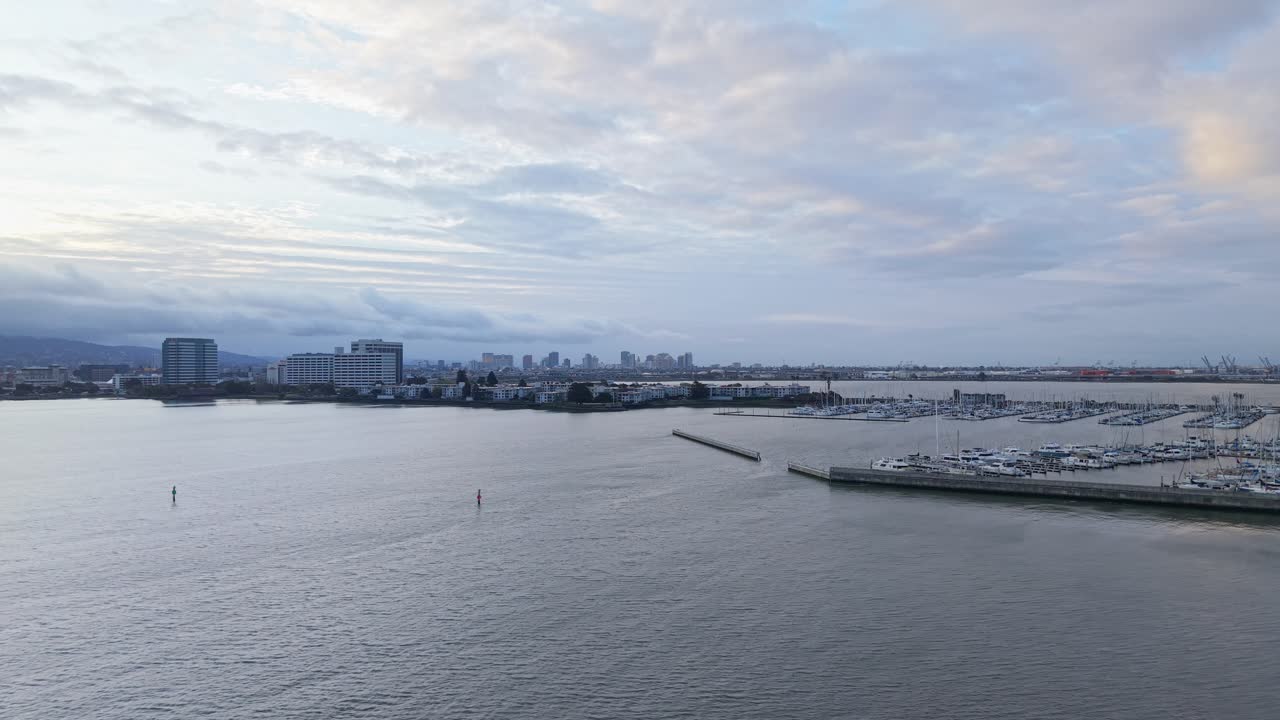 Panning aerial shot of the Emeryville Marina Park during the morning.