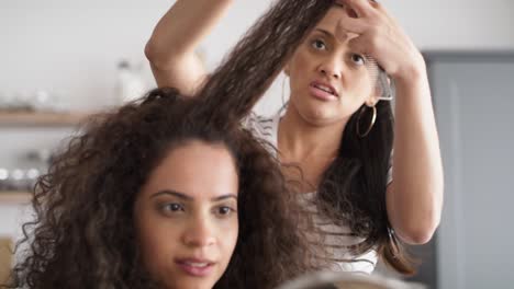 video of women while trimming their hair at home