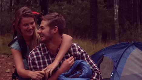 couple setting up their tent for the night