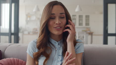 Business-woman-getting-good-news-on-phone-at-home-office.-Girl-feeling-happy.