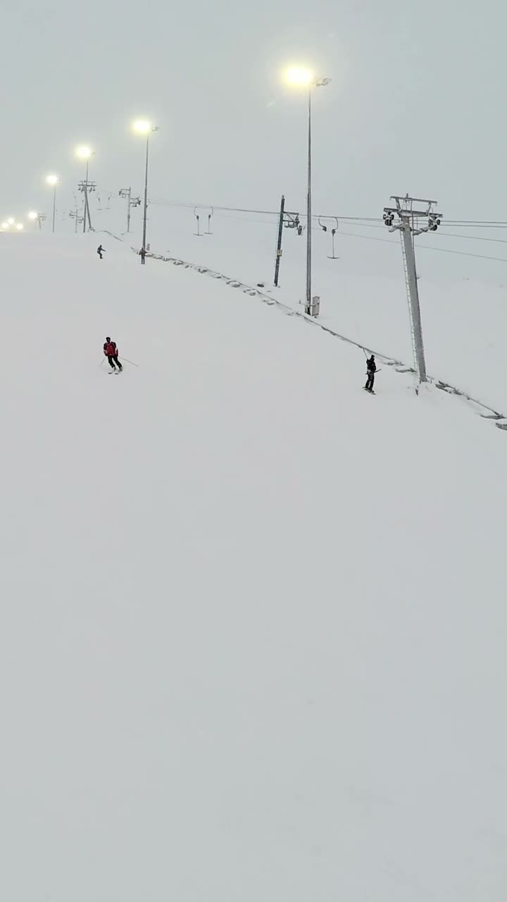Skiing on a Snowy Hill with Lift