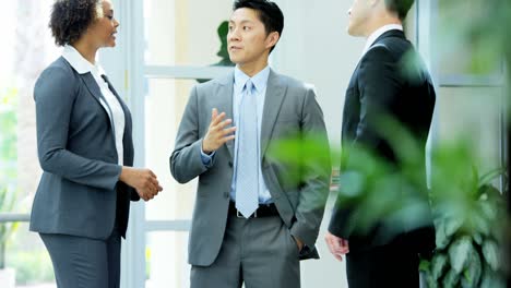 male female multi ethnic real estate office meeting