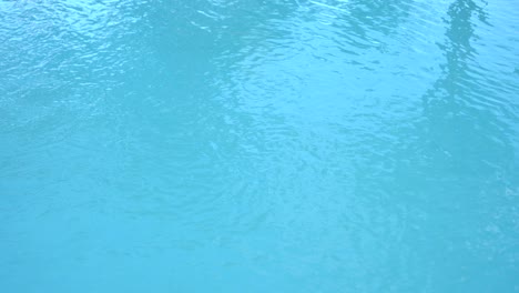 water surface texture, slow motion looping clean swimming pool ripples and wave, refraction of sunlight top view texture sea side white sand, sun shine water loop background,