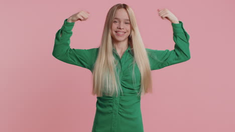 fit sporty caucasian woman showing biceps and looking confident feeling power strength success win