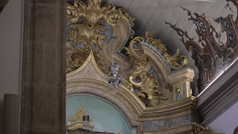 ornate church interior with intricate gold detailing and painted ceilings