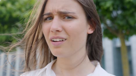 Classy-brunette-showing-emotions-for-not-understanding,-close-up-portrait