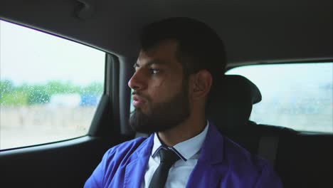 man sitting in car