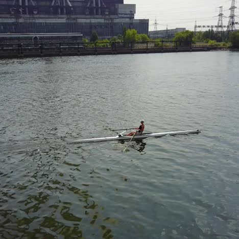 training athlete in kayak. training of small sportsmen rowers on a kayak on the river
