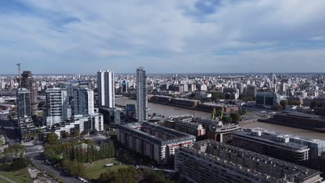 city river in between modern skyscraper buildings in buenos aires