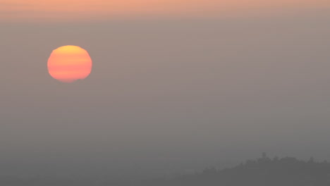 time lapse of sun rising through the haze from mount hollywood in griffith park