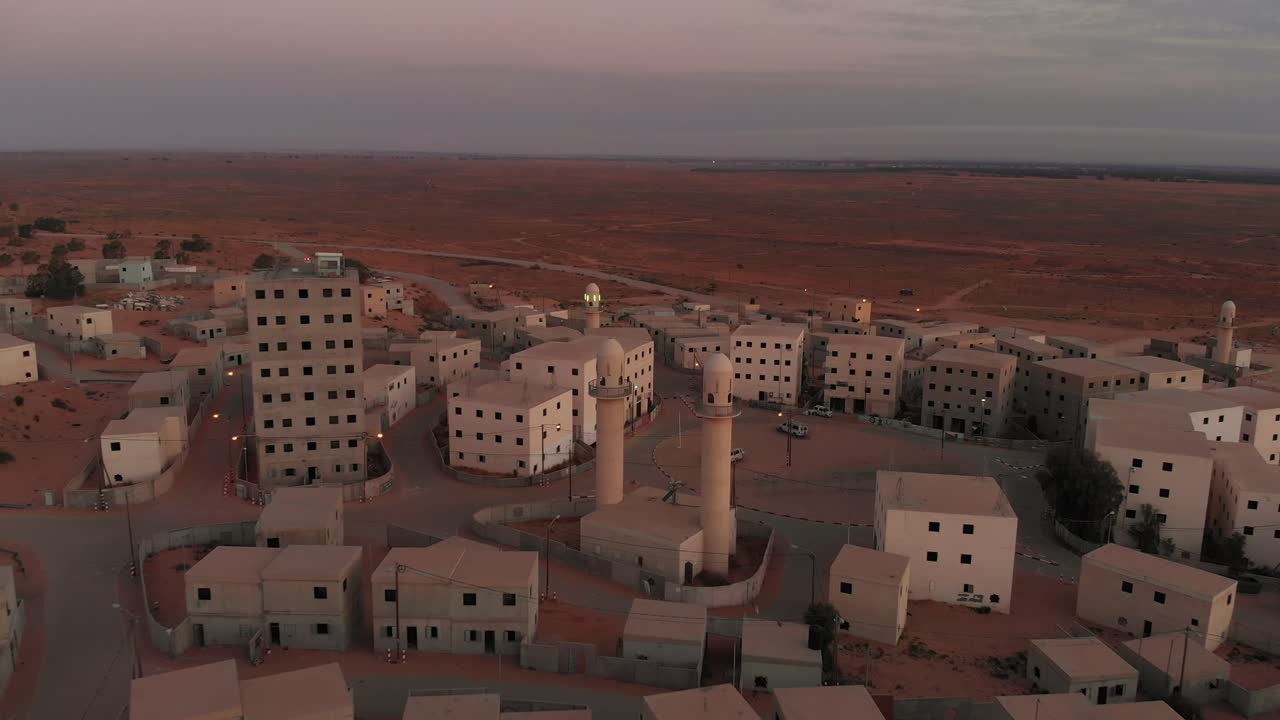 aerial view with camera moving forward at morning of an old empty city in the desert in palestine near Gaza