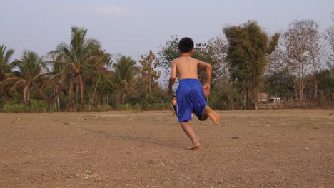 boy running in a field